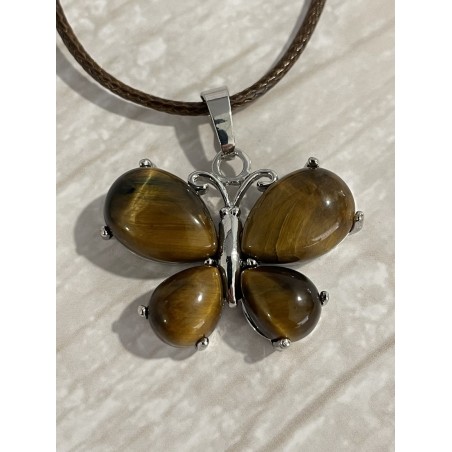 Pendentif papillon en œil de tigre et métal argenté. Pendentif papillon en œil de tigre et métal argenté.