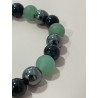 Détail des perles en aventurine verte, hématite et œil de faucon du bracelet Le Sabreur Vert.