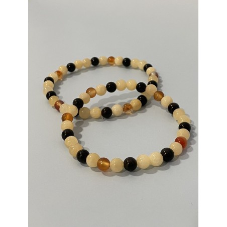 L’Orage Endormi – Bracelet en calcite orange, obsidienne noire et cornaline, existe en longueur 19 cm et 21 cm.