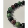 Détail des perles en prase, œil céleste et grenat du bracelet L’Héritier du Soleil.