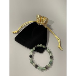 Le bracelet Les Poisons de la Cour et son écrin.
